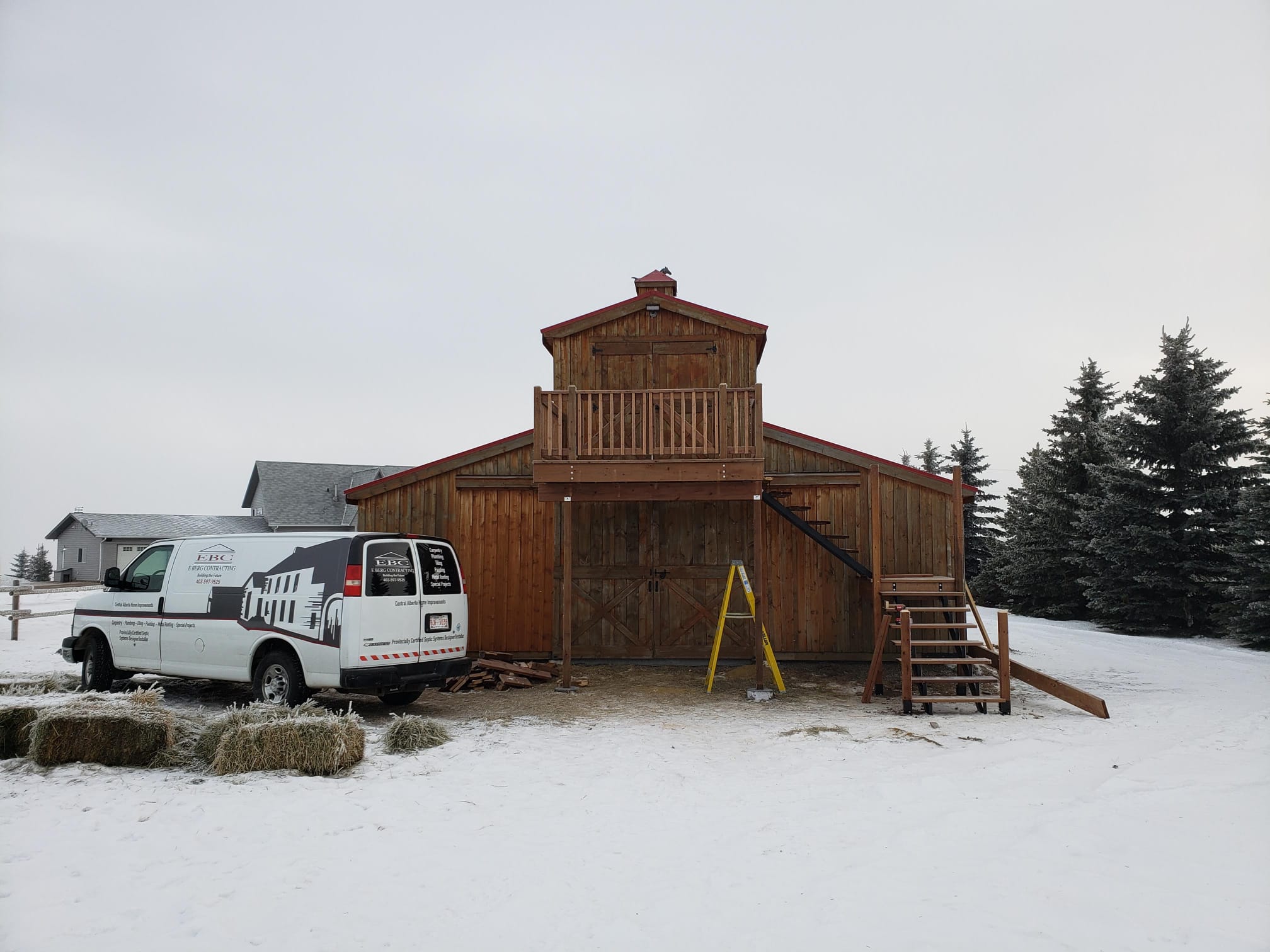 Building Berg company van at completed project
